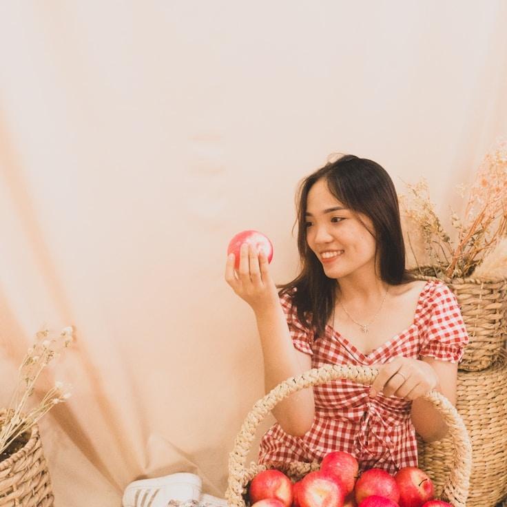 Kaveri Mehta, Lead Design Curator at Gentle Pixel Studio, reviewing corporate floral arrangements